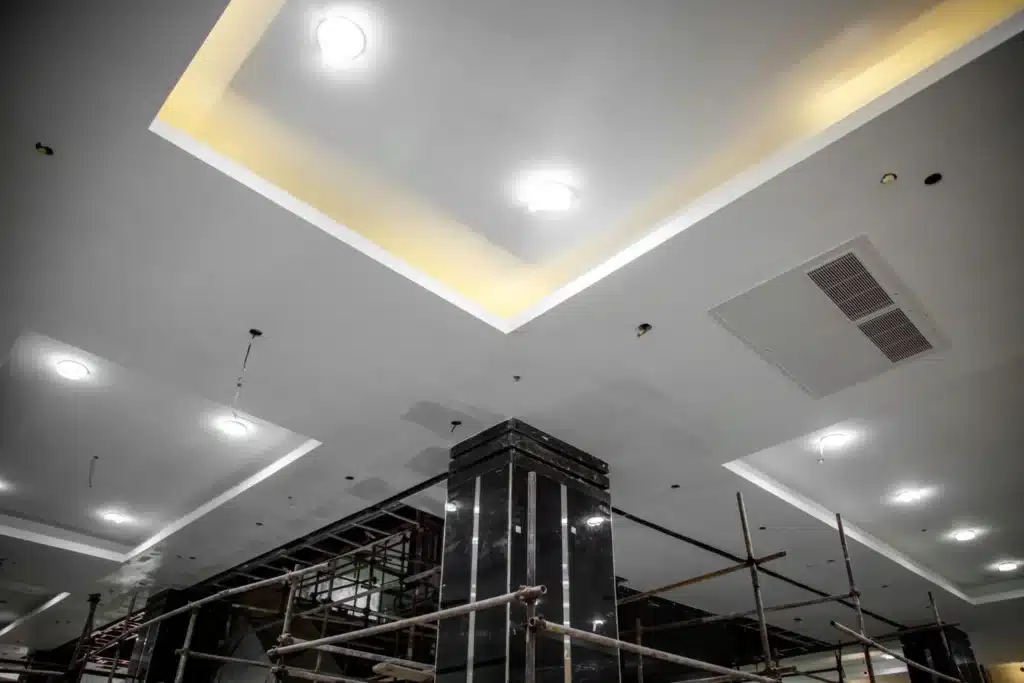 Ceiling lights and scaffolding in an interior under construction