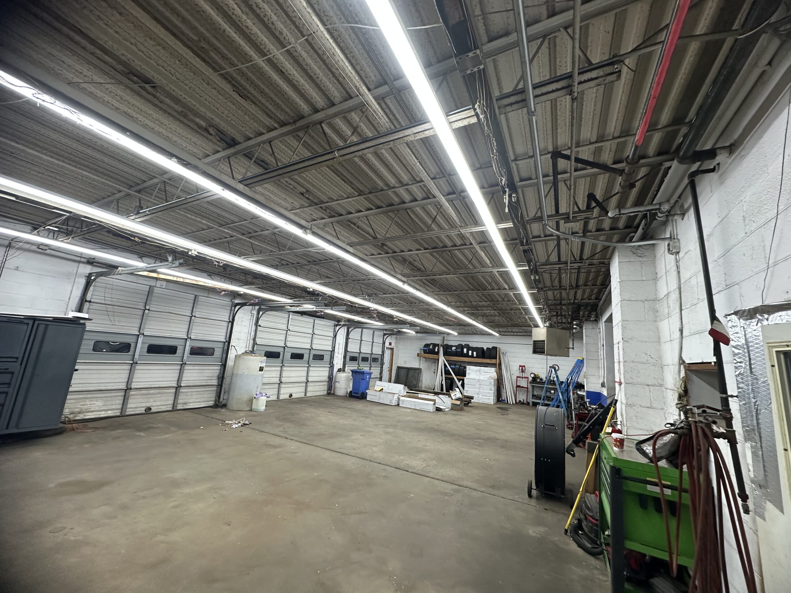 Industrial workspace with overhead LED lighting